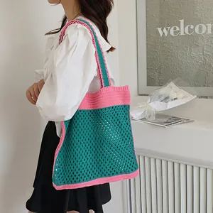 Pink and emerald green hand-knitted tote bag with crochet mesh design for women