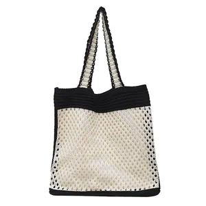 Minimalist beige and black knit tote bag with mesh design for casual summer commute