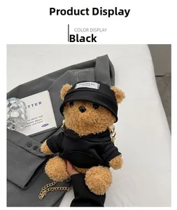 Close-up of cute plush bear bag in black hoodie with stylish gold chain strap