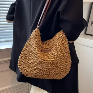 Minimalist summer straw woven shoulder bag with brown leather strap and detail