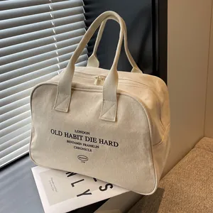 Large beige canvas tote bag with London print for daily commute and casual style