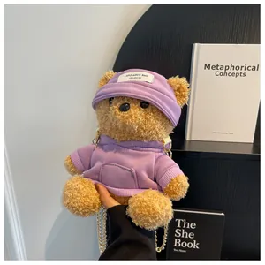 Detail of cute teddy bear plush bag with purple hoodie and golden chain strap for women