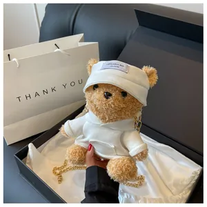 Close-up of cute plush bear bag in premium gift box with gold chain strap detail