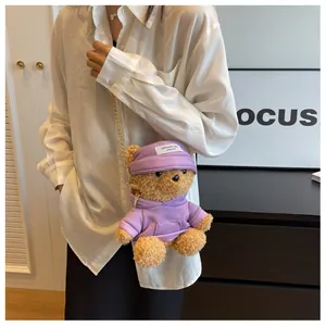 Detail of cute bear plush crossbody bag with purple hoodie and gold chain strap