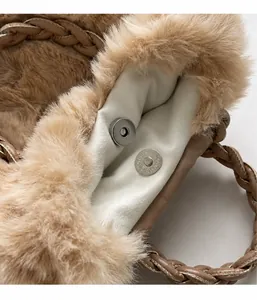 Detail of the soft faux fur bag interior showing the silver magnetic clasp and lining