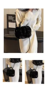 Black faux fur tote bag featuring a woven handle and slender shoulder strap details