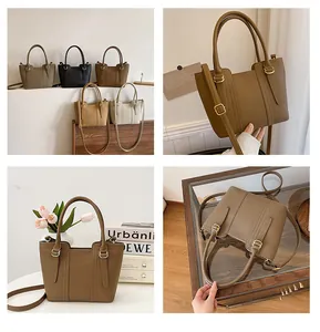 Detail view of five stylish textured bucket bags with dual handles and golden hardware