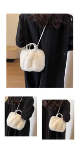 Close-up of the beige plush cloud bag texture with woven handle and soft faux fur detail
