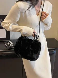 Faux fur plush tote bag with woven handles and leather strap shown on a model