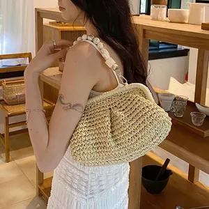 Woven straw cloud bag with marble bead strap and elegant pleated design for summer