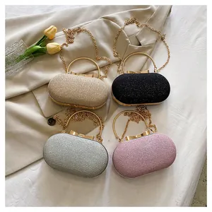 Collection of glitter hardshell evening clutches in champagne, silver, black, and pink
