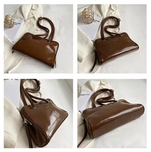 Detailed views of a dark brown glossy faux leather shoulder bag with sleek office aesthetics