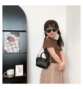 Mini black lychee pattern handbag with silver chain and matching square sunglasses