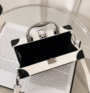 Detailed interior view of a vintage radio-style box bag with black lining and metal handle