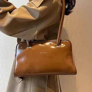 Retro brown glossy leather shoulder bag with silver logo for women stylish winter commute