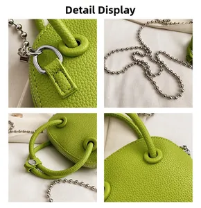 Detailed macro view of lime green lychee leather texture and silver bead chain handle