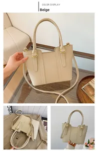 Detailed views of beige lychee pattern handbag with golden hardware and long strap