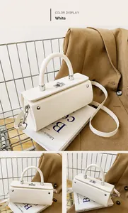 Detail of white cylindrical leather bag featuring silver buckle and detachable shoulder strap