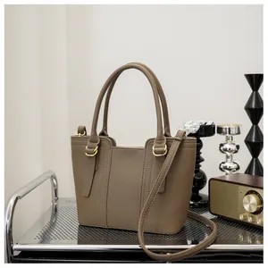 Litchi pattern leather bucket bag on a cart with a vintage radio in a styled room