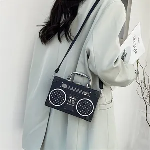 Creative retro radio shaped crossbody bag in black leather with metal handle for women
