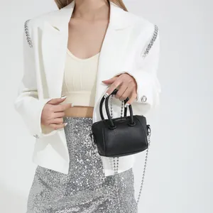 Mini black leather tote bag for kids with stylish silver bead chain strap and metal logo