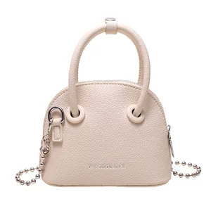 Chic beige crossbody bag with litchi texture and silver bead chain handle for women