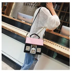 Creative house-shaped PU leather crossbody bag featuring a pink quilted roof and gold clasp