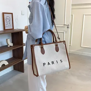 Bolso tote de lona minimalista con estampado Paris y ribete de cuero marrón estilo elegante