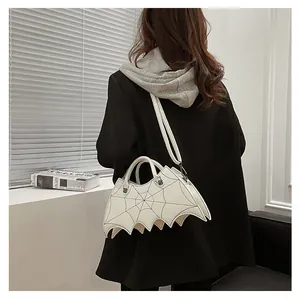 White bat-shaped gothic handbag with spider web stitching and silver hardware detail