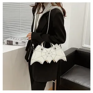 Detailed view of white gothic bat bag with spiderweb stitching and detachable strap