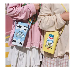 Vue détaillée des sacs à bandoulière créatifs en forme de brique de lait bleu et jaune