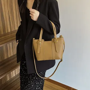 Brown lychee pattern PU leather tote bag with gold hardware and detachable strap