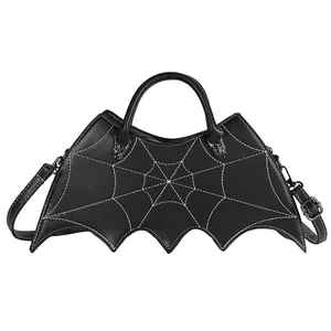 Gothic bat-shaped black crossbody bag with white spider web stitching and wing design