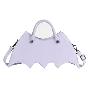 Detail of lavender gothic bat bag featuring spider web stitching and silver hardware