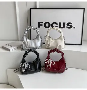 Mini pleated cloud bags in silver, white, black and red with pearl bow and chain straps