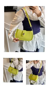 Detail view of the yellow saddle bag with silver metal twist lock and textured finish