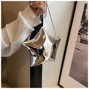 Detailed view of a silver mirror-finish star-shaped handbag with a slim snake chain
