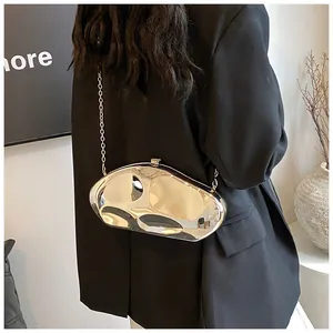 Detail of silver metallic textured crossbody bag with liquid metal finish and chain