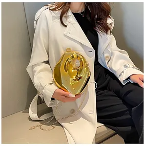 Artistic gold irregular acrylic evening clutch with fluid metal texture and chain strap