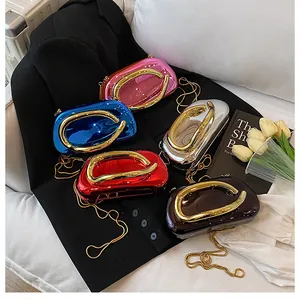 Polished metallic evening clutch bags in multiple colors with gold ring handles and chains