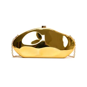 Chic pebble shaped gold acrylic evening bag with metallic finish and chain strap