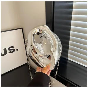 Modern silver acrylic clutch bag with irregular geometric shape and thin chain strap