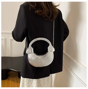 Silver crescent woven clutch bag with metallic texture shown as a stylish crossbody