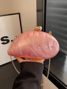 Pink marble acrylic evening clutch bag with gold sphere clasp and metal chain strap