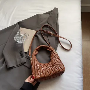 Brown pleated rhinestone underarm bag with elegant chain strap and crescent moon design