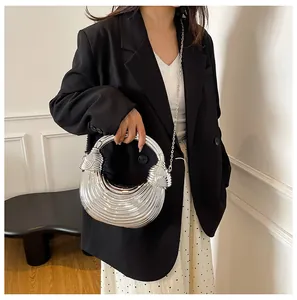 Metallic crescent crossbody bag with pleated texture and thin chain strap detail