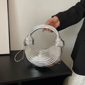 Silver metallic crescent handbag with pleated texture and stylish knotted handle