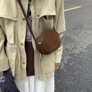 Minimalist vintage brown suede shoulder bag for women with metallic zipper and leather strap