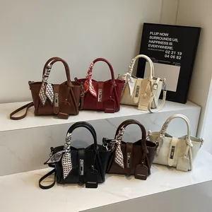 Chic women's bucket bags with silk scarves and metal hardware in six versatile colors