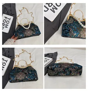 Macro detail of Chinese shell-style handbag with floral brocade and pearl strap